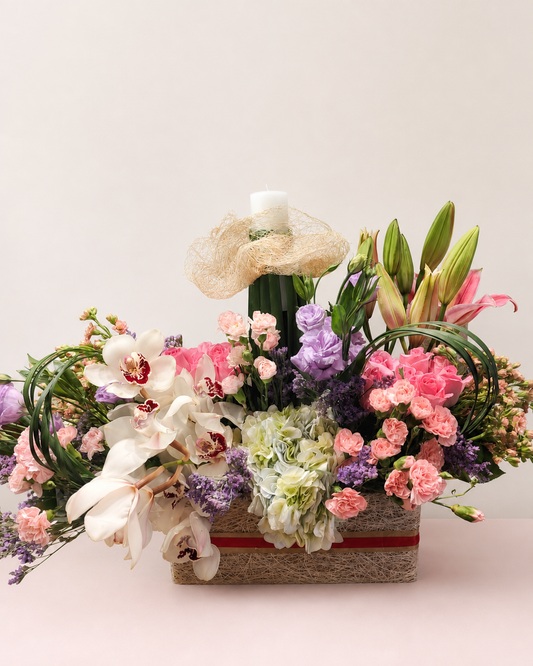 White cymbidium orchids, pink lilies and hydrangeas in a luxury flower basket by James Flowers Mumbai