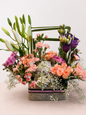 Peach roses, white lilies and purple lisianthus luxury flower basket by James Flowers Mumbai